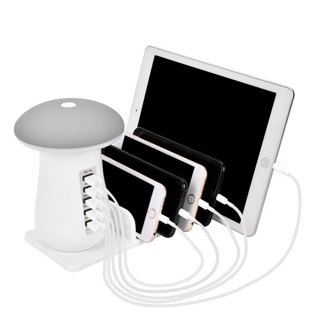 White mushroom-shaped LED desk lamp with a 5-port USB charging dock station at its base on a wooden table