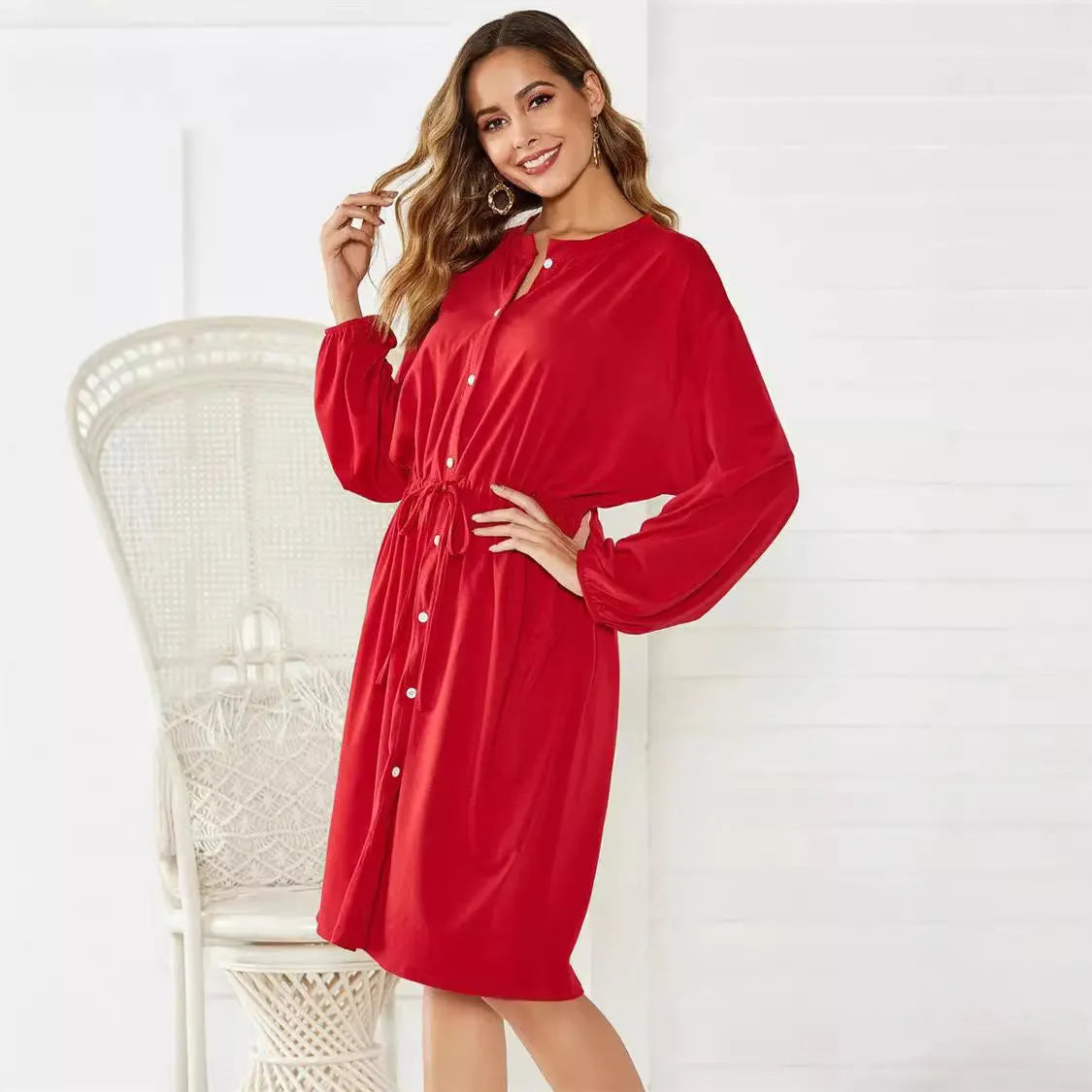 Black A-line dress with elastic waistband and cuffs, mid-length design for professional wear
