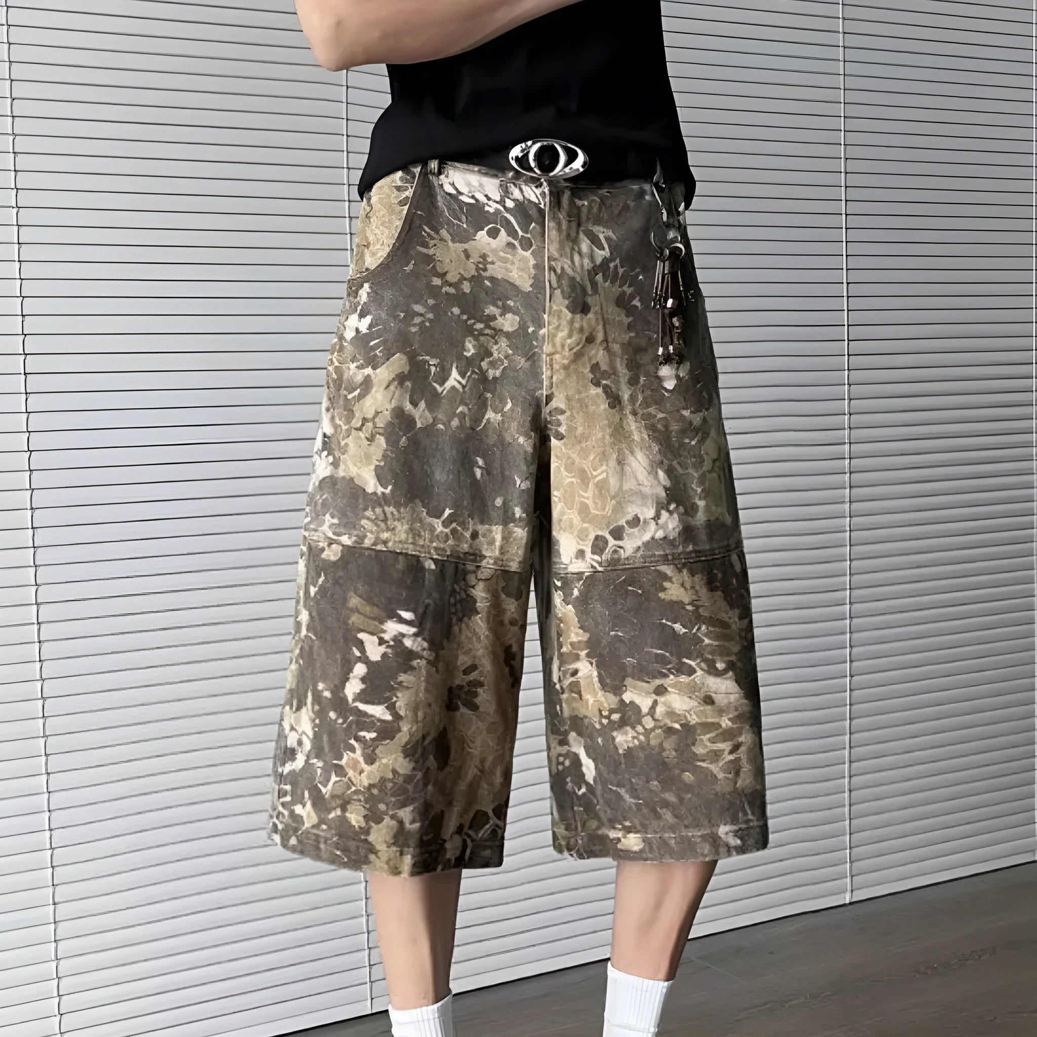 Yellow snake pattern camouflage cropped jeans on hanger showing tooling detail