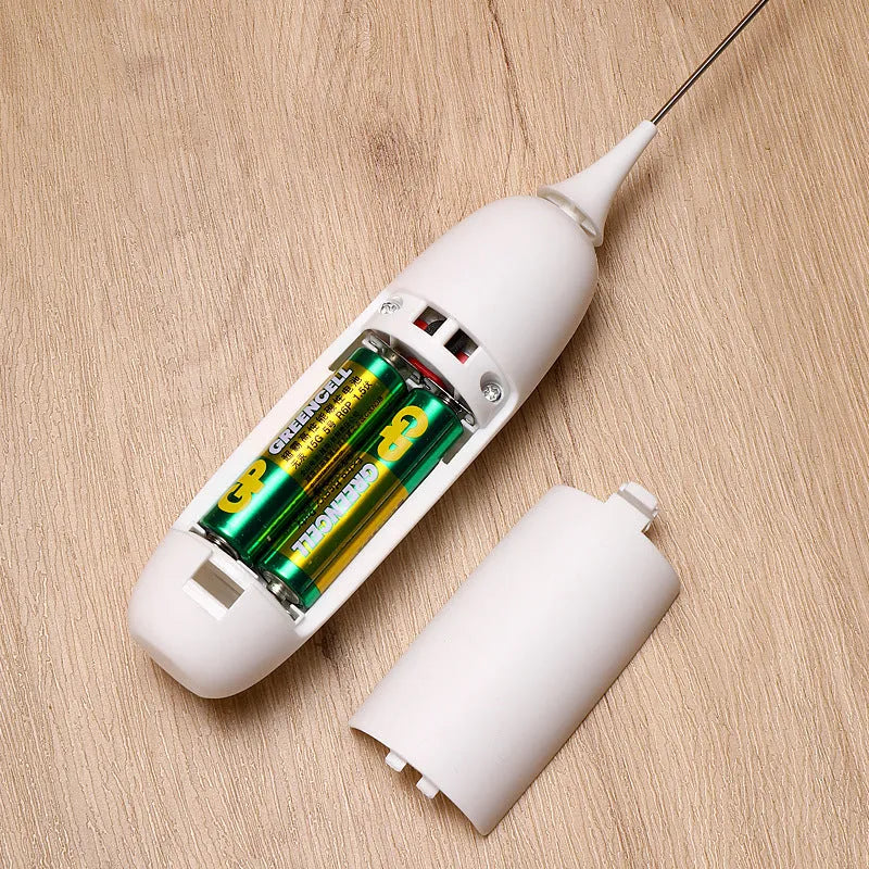 Black and white electric milk frother handheld blender for coffee drinks