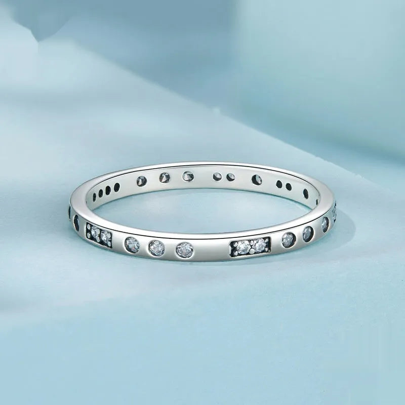 Moss Password black oxidised silver I Love You ring on a jewellery display.