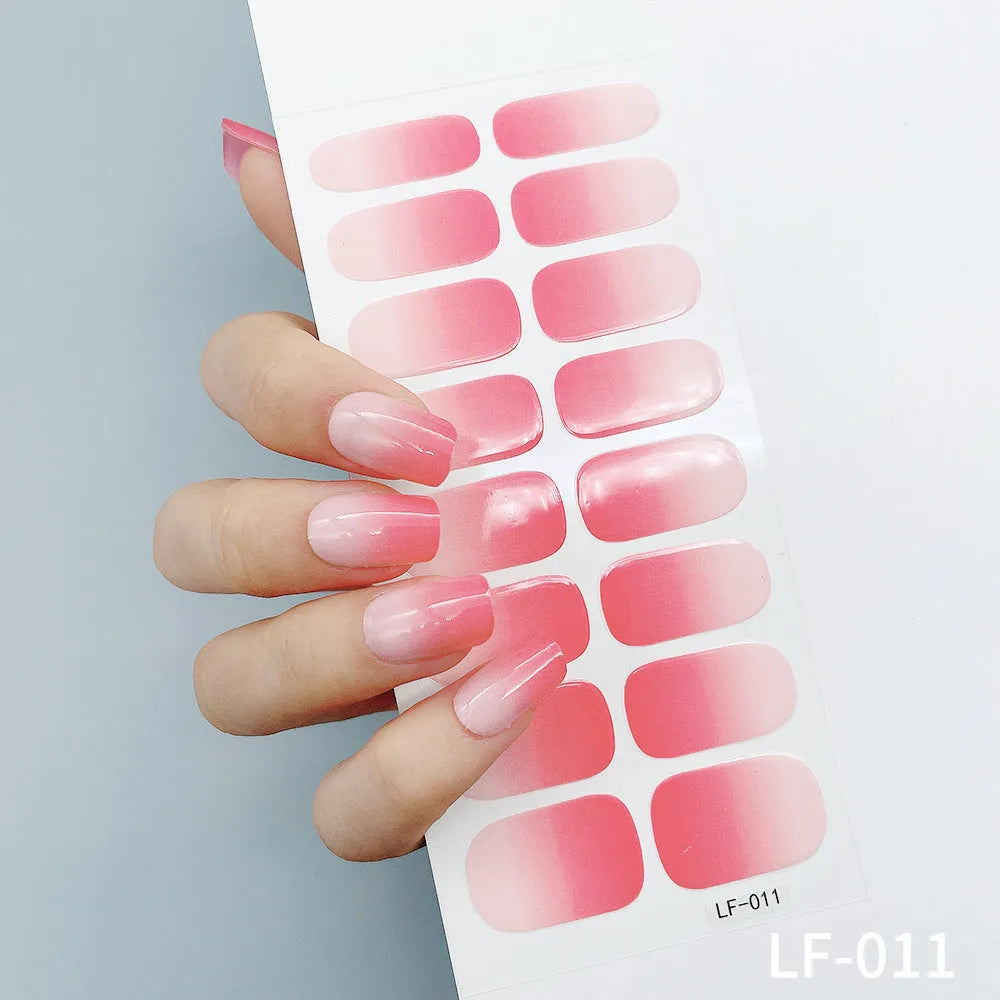 Set of 16 solid colour nail art stickers showing floral, geometric, and pattern designs for manicure application