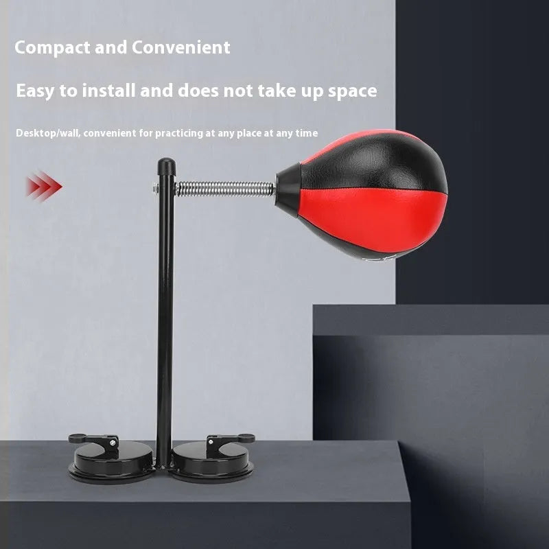 Pear-shaped black PU boxing reaction ball mounted on a wall with double suction cups for home training.