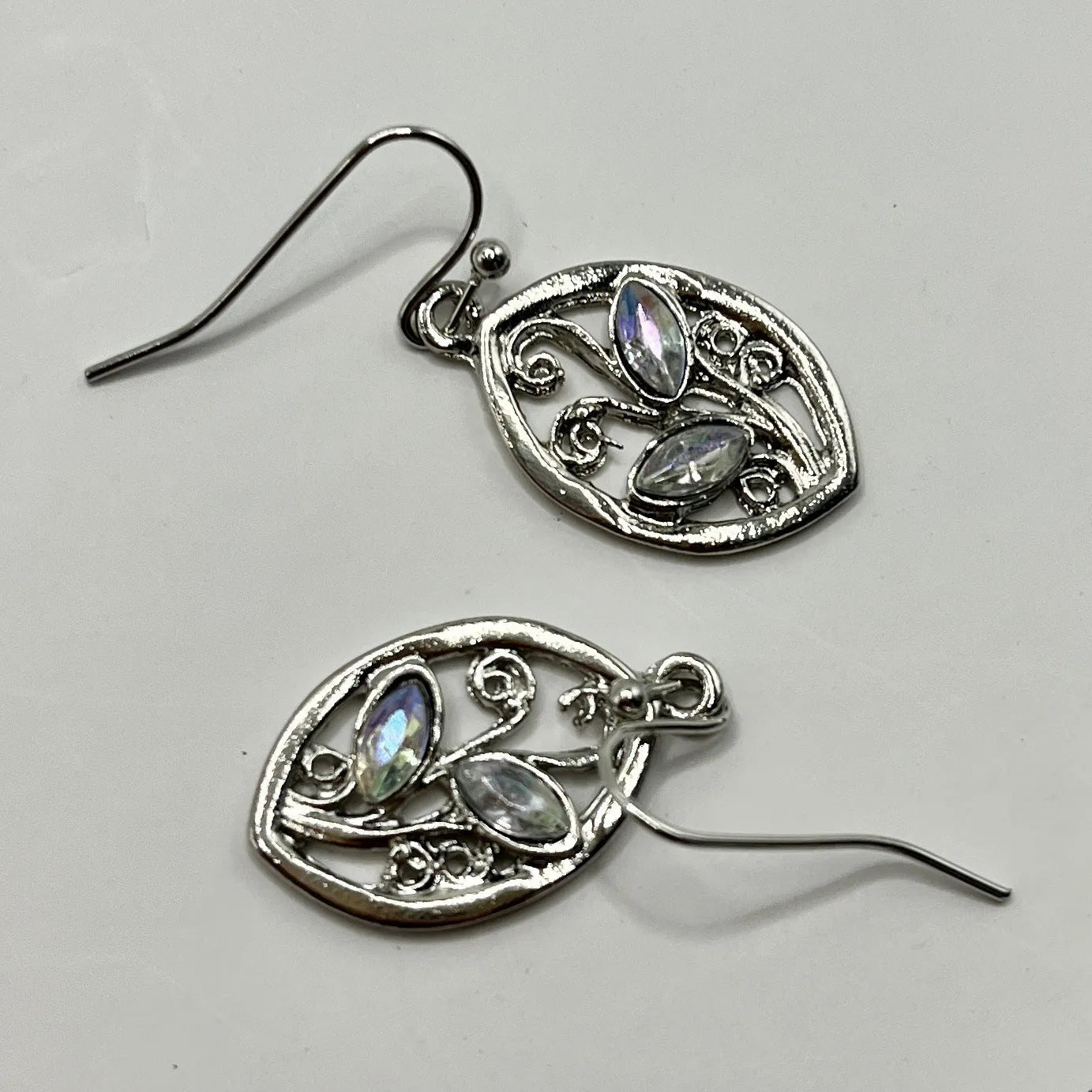 Silver leaf-shaped earrings with colourful moonstone stones embedded in alloy design