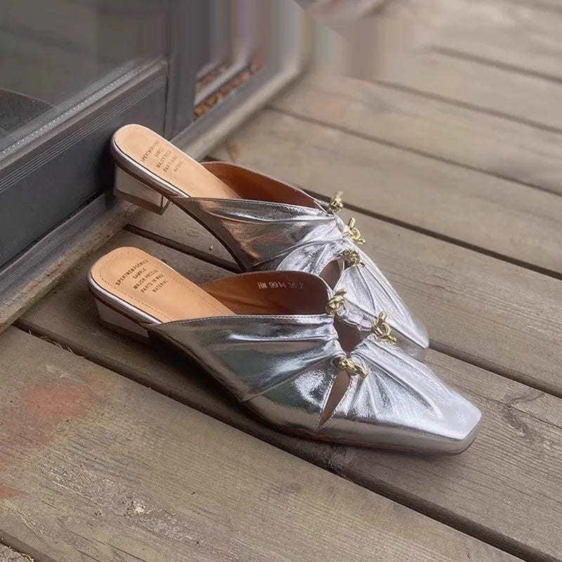 Women's genuine leather half toe cap slippers in silver with square toe and low TPR sole.
