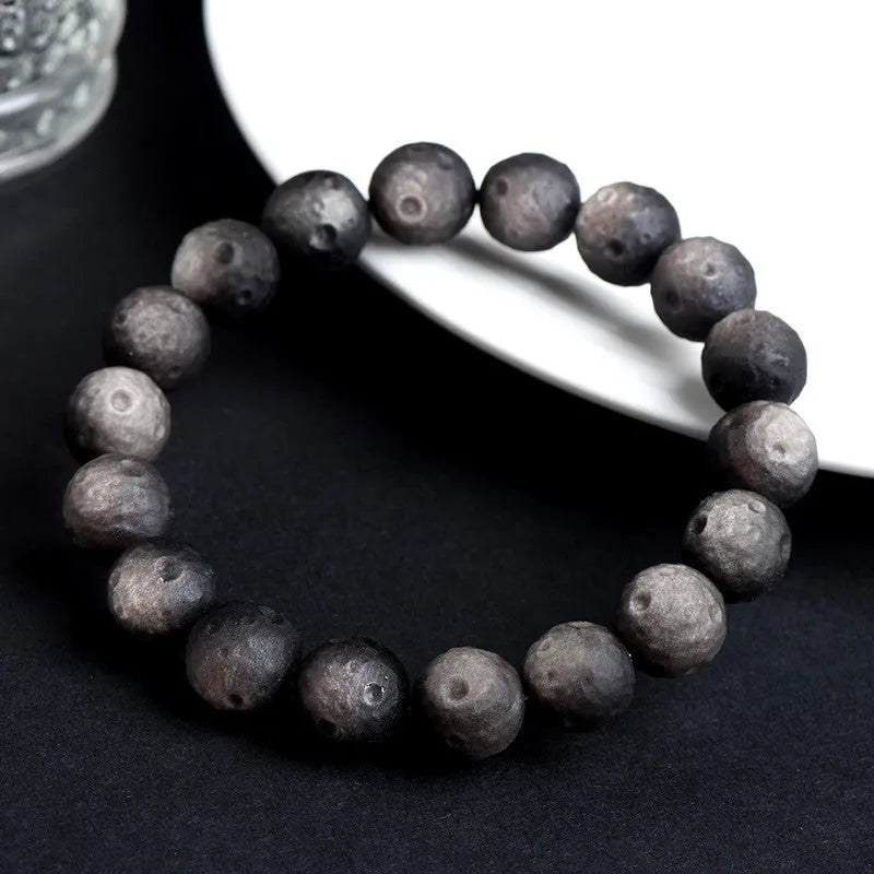 Obsidian crater ball bracelet with textured beads in silver stone or golden meteorite finish