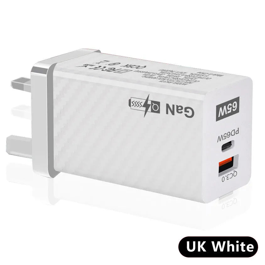 White and black 65W Gallium Nitride USB-PD laptop charger with EU, UK, and US plug options.