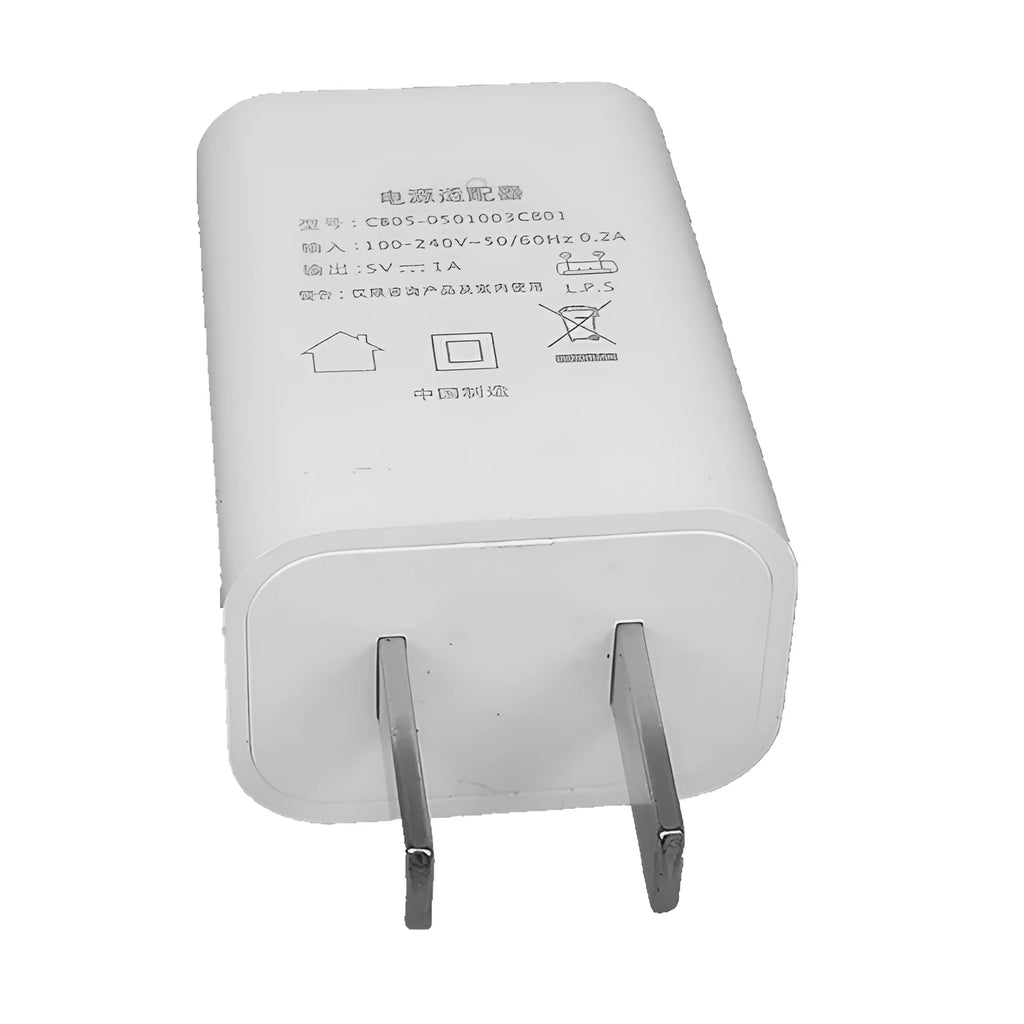 Thin white standard USB power adapter with CE and FCC logos, 5V 1A output.