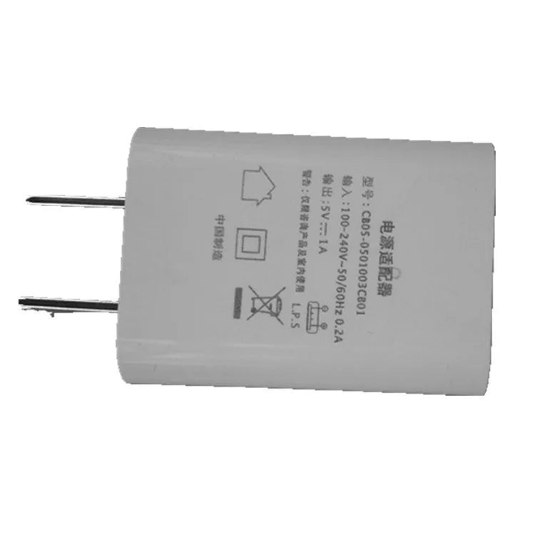 Thin white standard USB power adapter with CE and FCC logos, 5V 1A output.