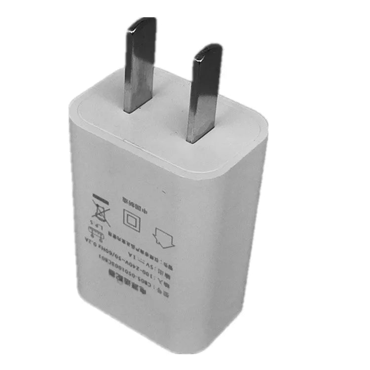 Thin white standard USB power adapter with CE and FCC logos, 5V 1A output.