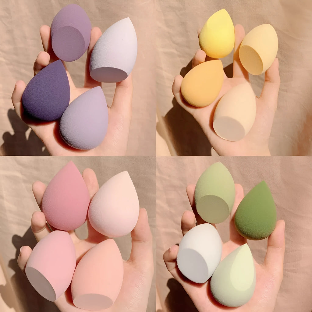 Set of four small 6cm cubic makeup sponge storage cases in grape, mango, mint, and peach colours.