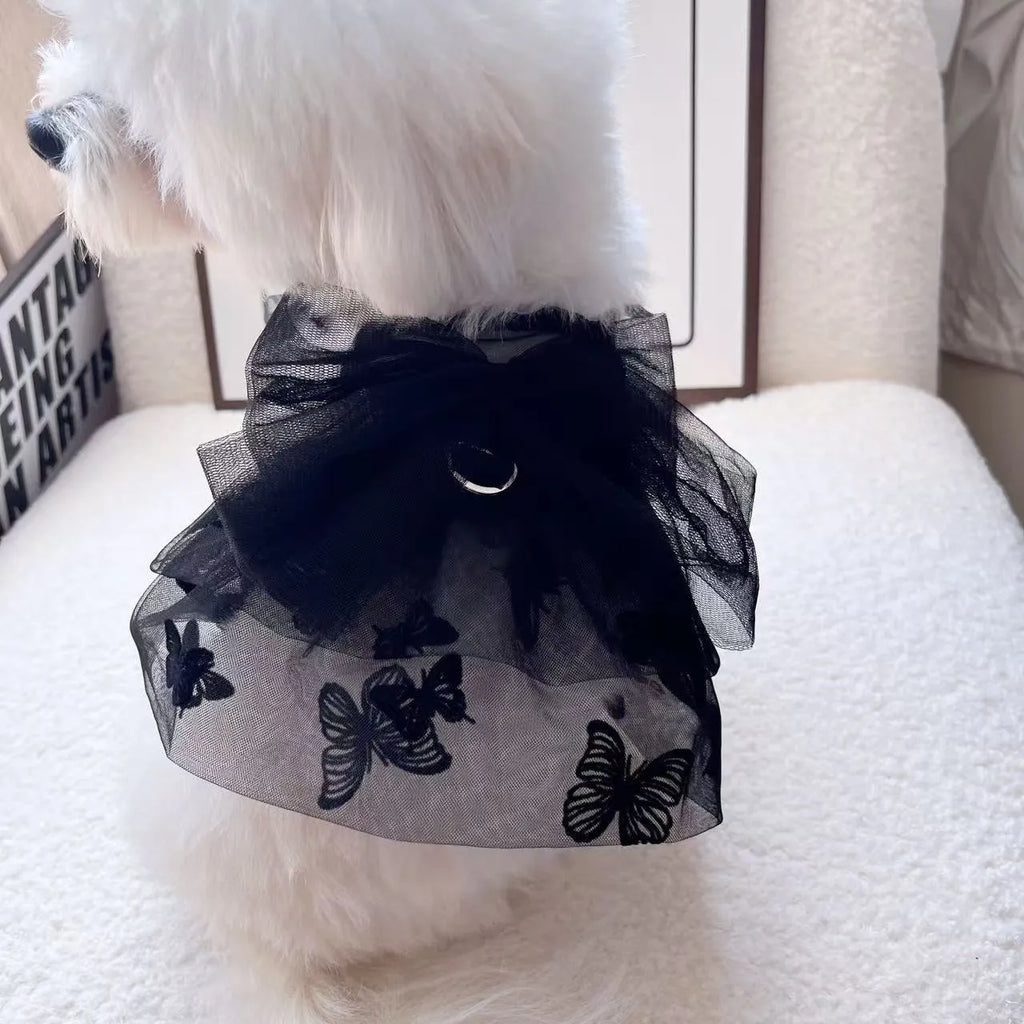 Black polyester tulle princess skirt costume for a small dog or cat on a mannequin, showing the gauzy fabric.