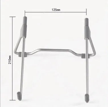 Grey adjustable aluminium and plastic stand holding a mobile phone and a laptop.