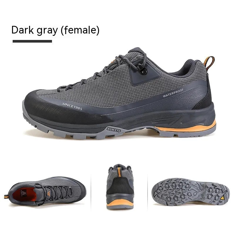 Men's low-top mountain climbing hiking boots with rubber outsole and lace-up front