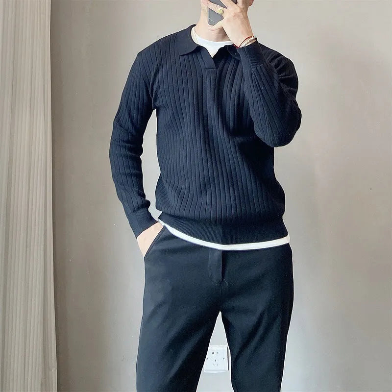 Man wearing a loose grey rabbit fur blend knitted pullover sweater, casual autumn style.