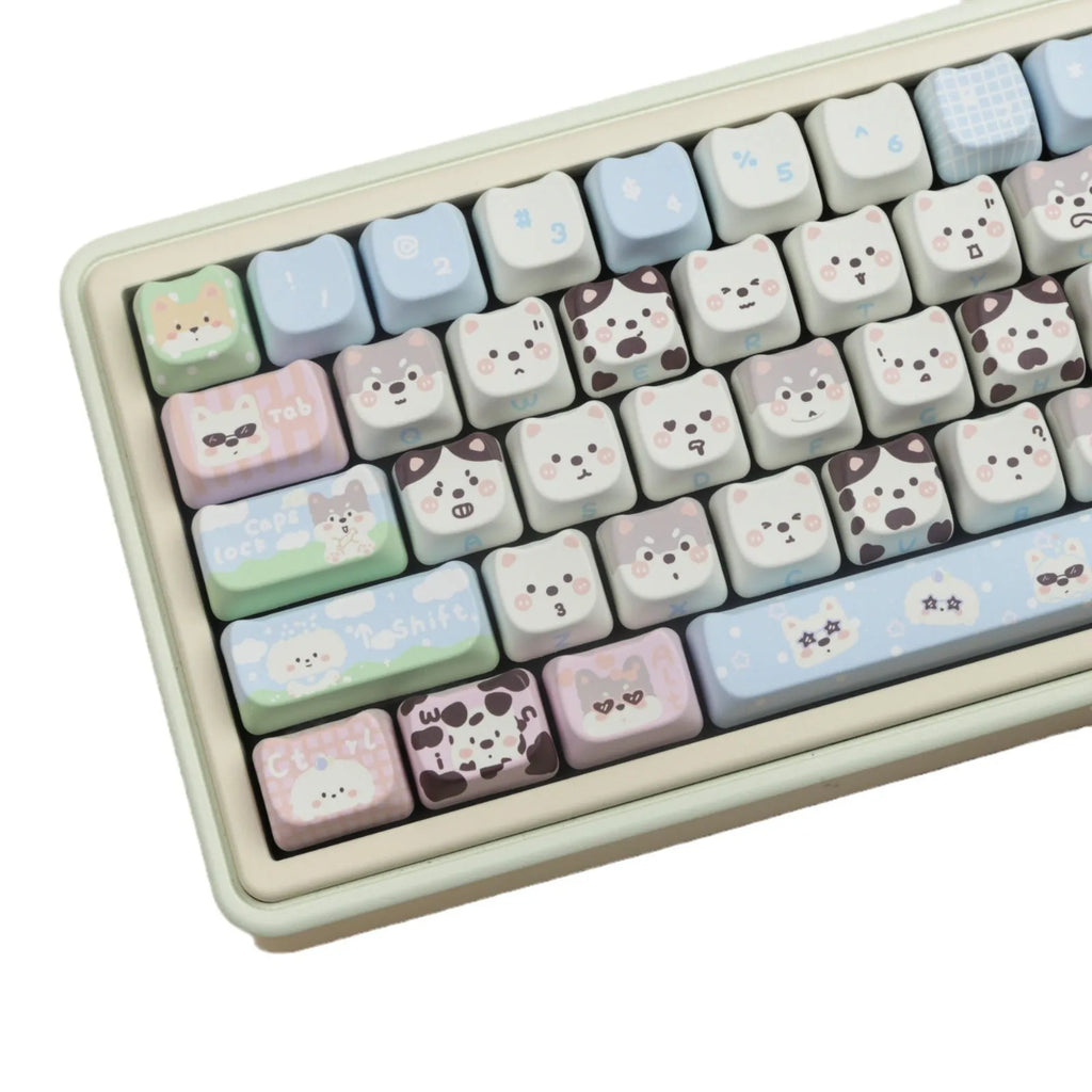 PBT sublimation key cap set showing colourful cat and puppy character designs on mechanical keyboard keys