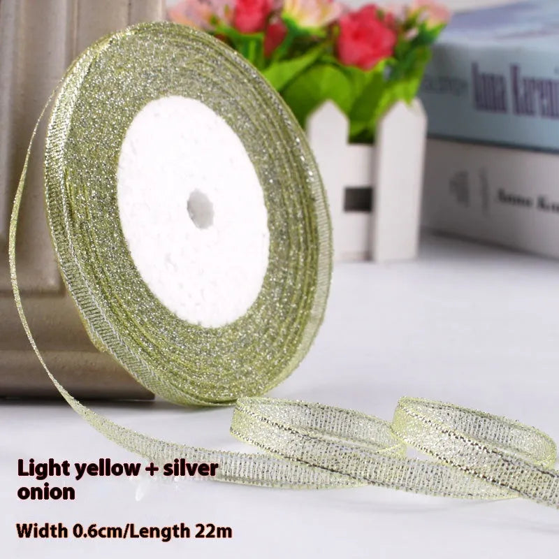 Roll of narrow 0.6cm wide polyester gift wrapping ribbon in assorted colours, showing 22 metre length.