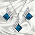Women's alloy and glass cross chain necklace with matching electroplated ear studs set