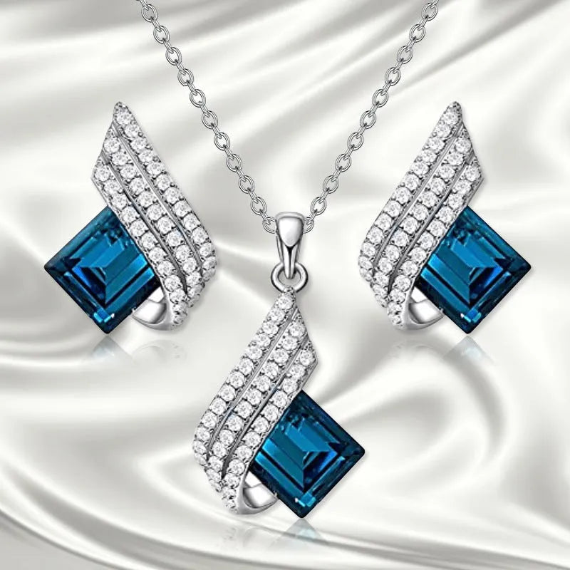 Women's alloy and glass cross chain necklace with matching electroplated ear studs set