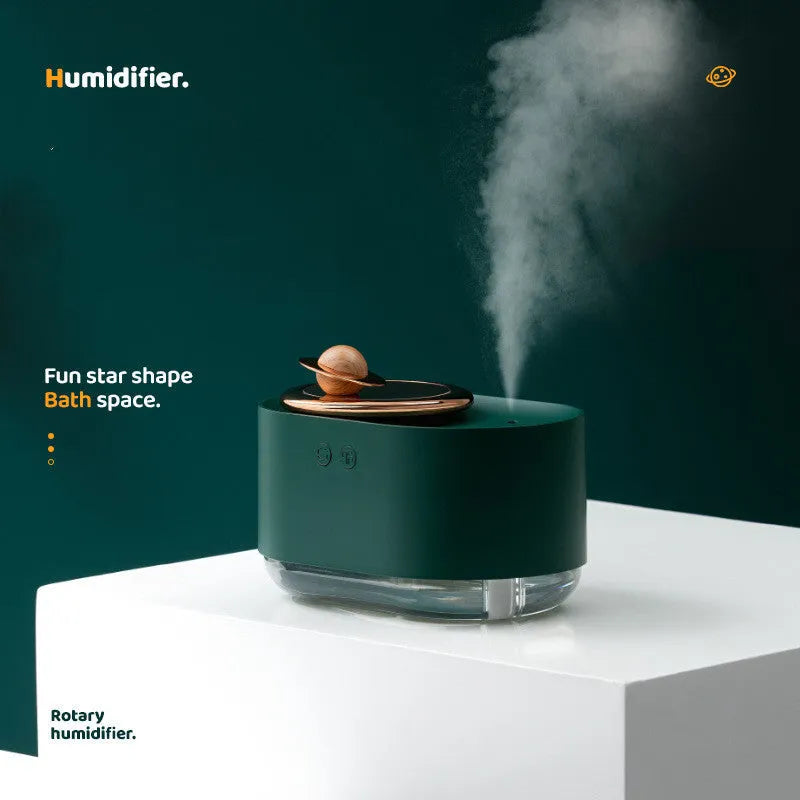 Rotating planet desktop humidifier with night light in green colour showing USB charging port and water tank