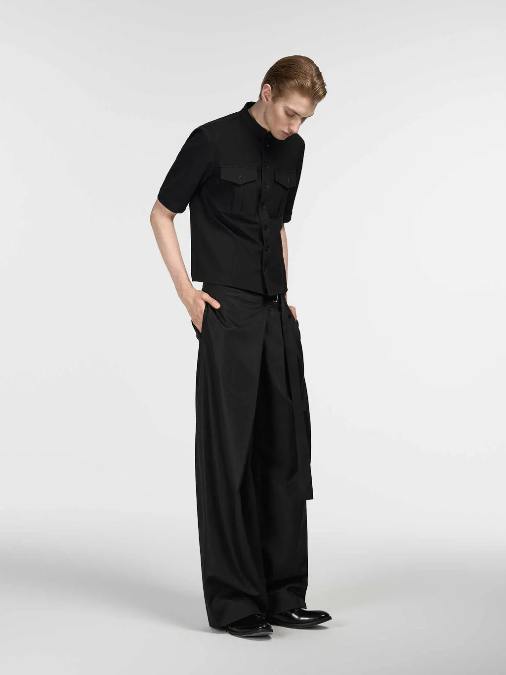 Black straight-leg trousers with adjustable waistband and single pleat front detail