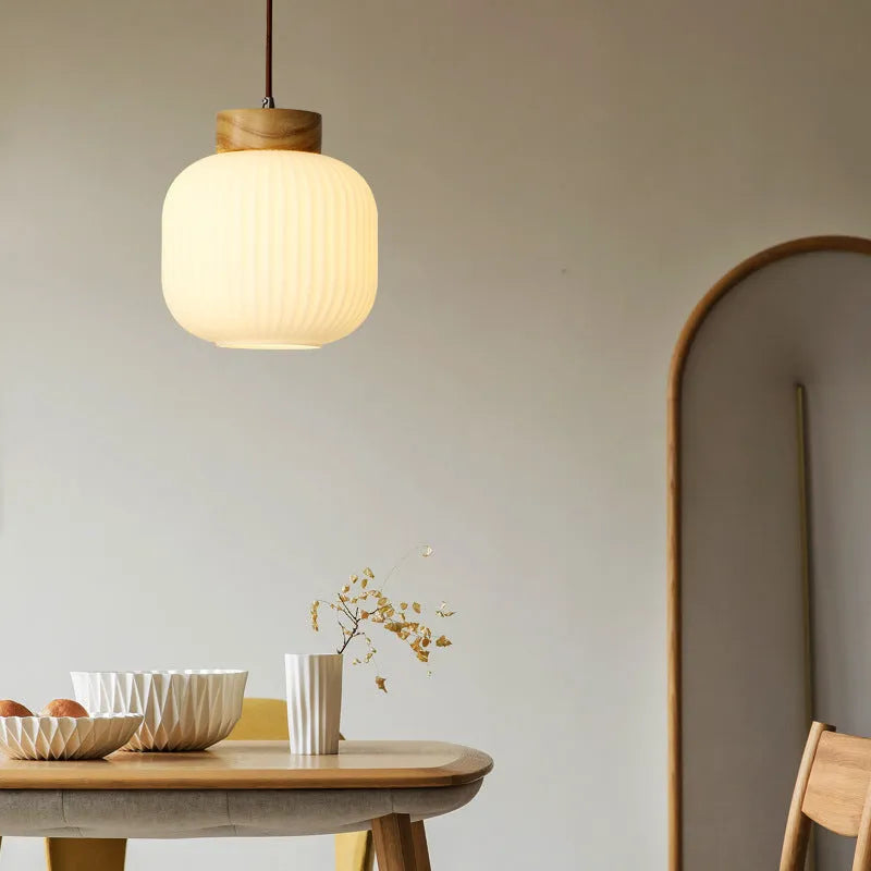 Nordic-style retro wooden pendant ceiling light with a natural wood finish, shown in a bedroom setting.