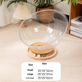 Transparent acrylic space capsule bathtub cat bed on a white background