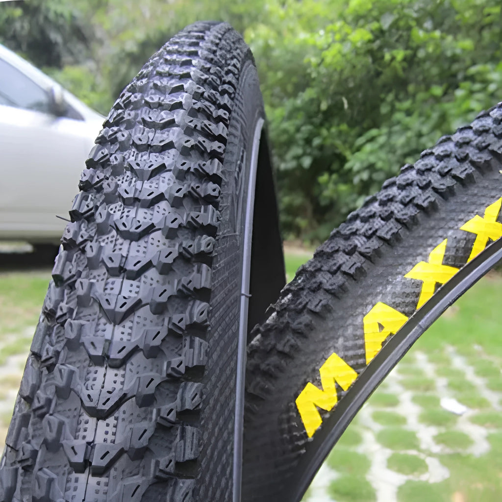 Ultralight mountain bike tyre with tread pattern shown, available in multiple sizes including 26, 27.5 and 29 inch diameters.