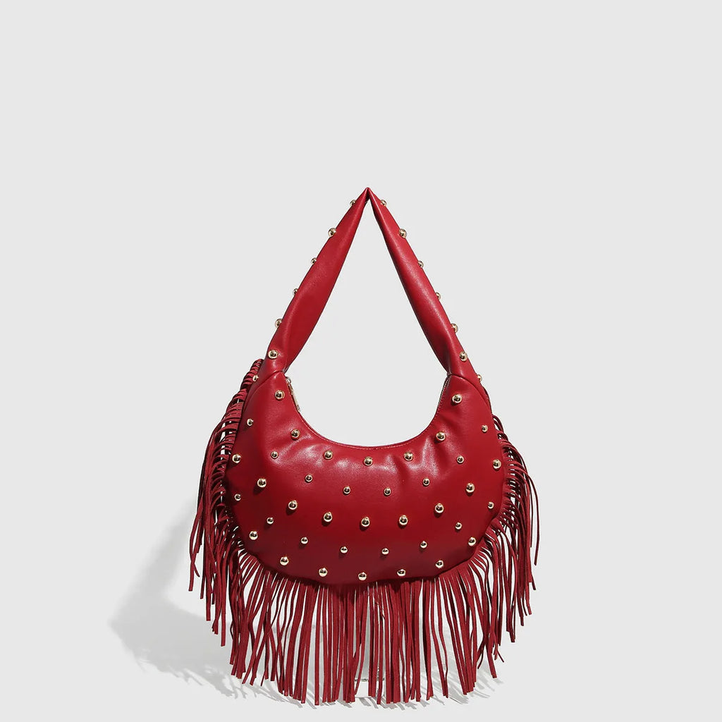 Retro black shoulder handbag with tassel detail showing internal phone compartment