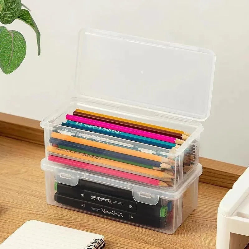 Clear plastic pencil storage box filled with coloured pencils and crayons
