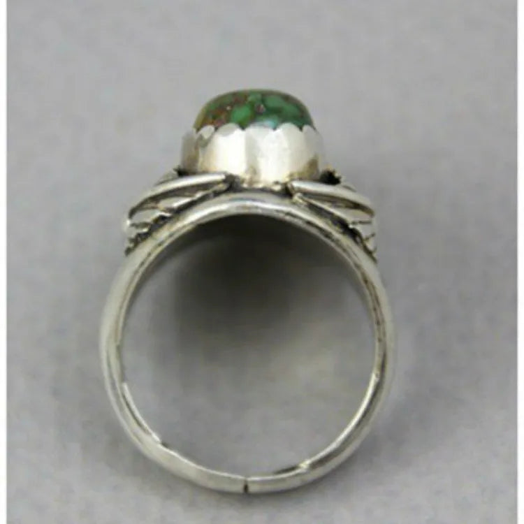 Turquoise geometric alloy ring with retro inlaid design on a woman's hand