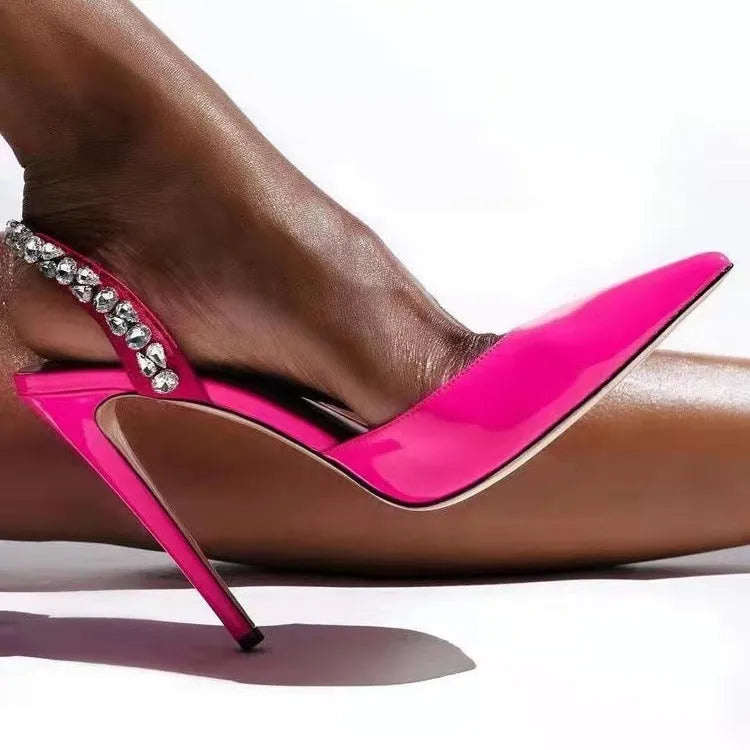 Pointed toe high heel sandals with rhinestone decoration on the side, in patent leather.