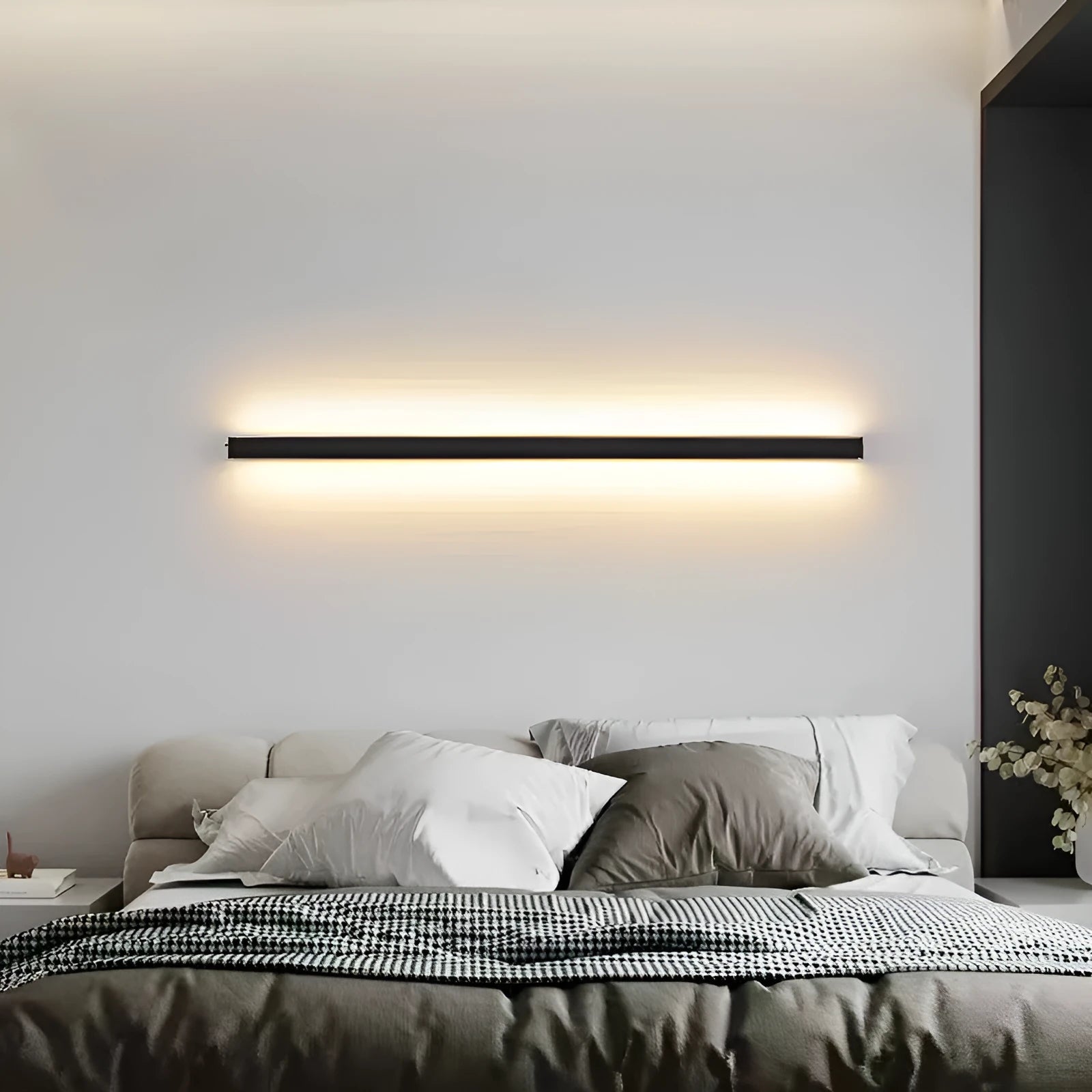 80cm long black LED wall lamp with touch control for three light colours on a white wall.