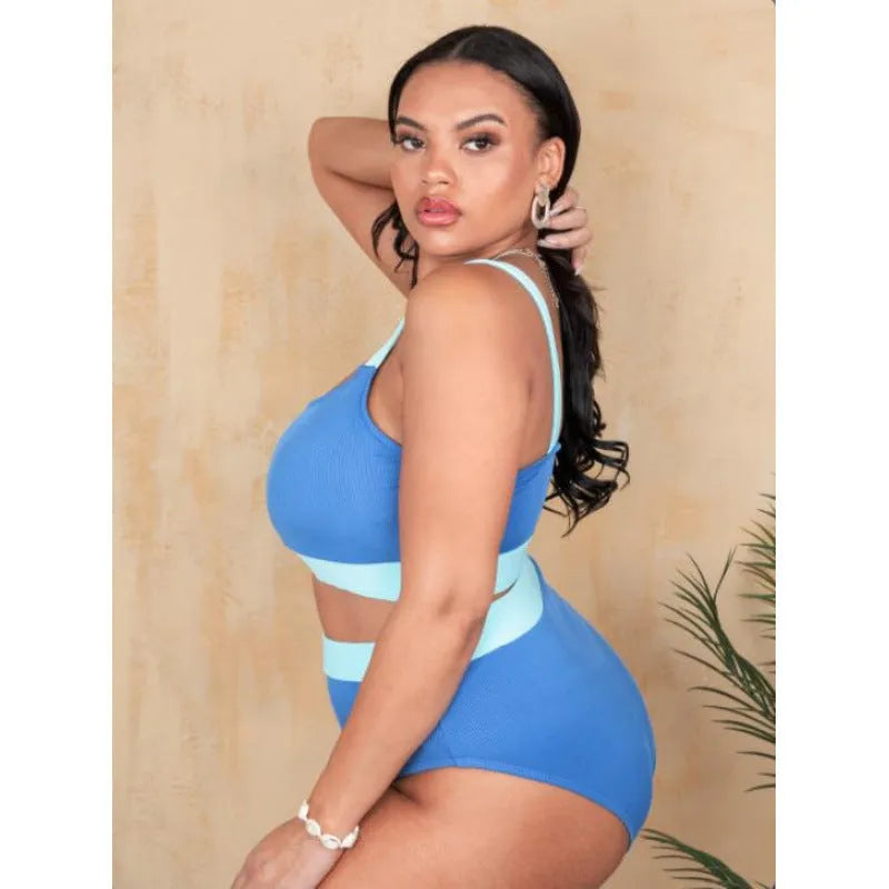 Women's high waisted polyester bikini swimsuit with split sides and intricate stitching details in solid colour