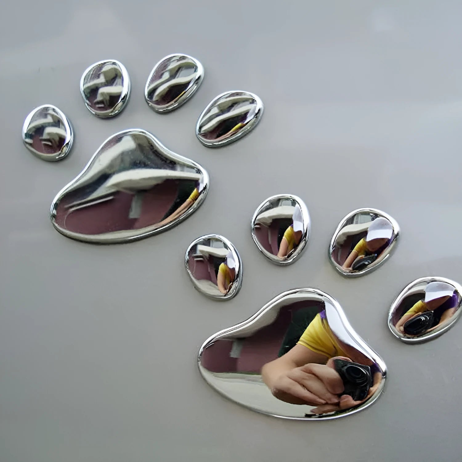 7cm long PVC car sticker with footprint design for bumper application in red, silver, gold or black colours