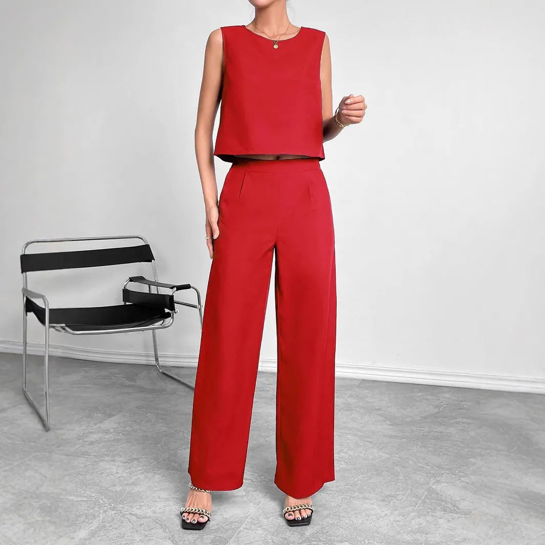 Women's red polyester two-piece set showing sleeveless round neck top with wide leg pants