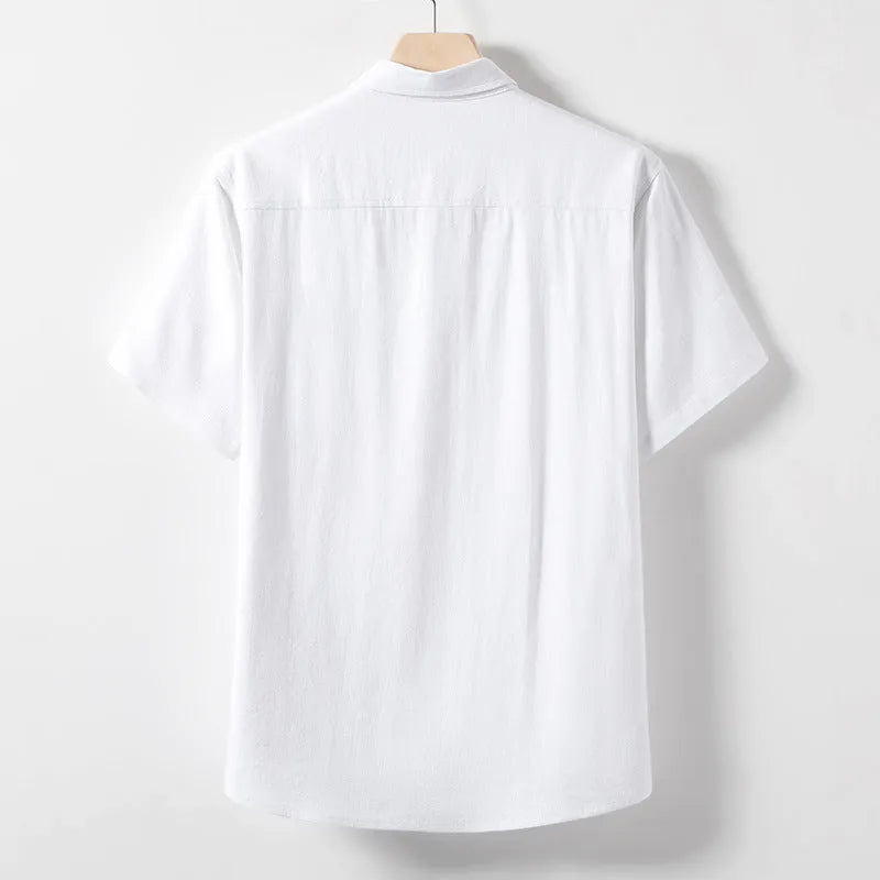 Men's loose-fitting linen-blend lapel t-shirt in black, shown on a model, highlighting the open collar and short sleeves.