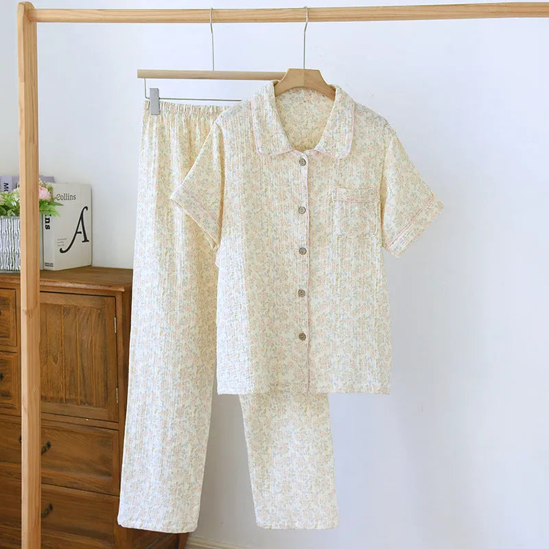 Women's loose-fit yellow plaid cotton gauze short-sleeve top and trouser set on a hanger.