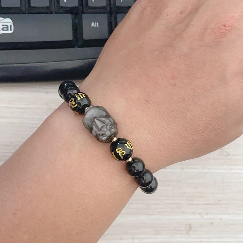 Men's silver stone bracelet with engraved zodiac and proverb designs on beaded surface