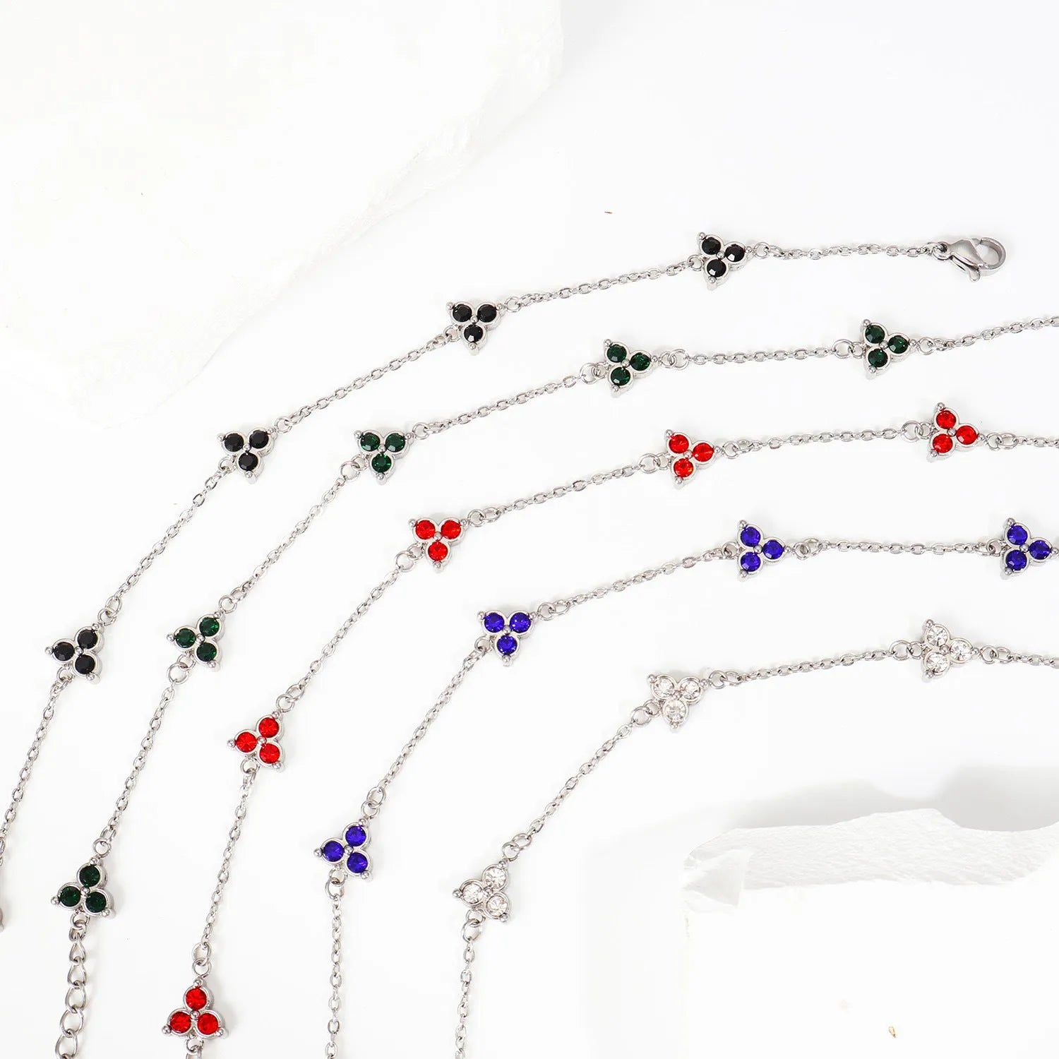 Geometric triangle women's bracelet in stainless steel with a choice of coloured centre stones on a gold or steel band.