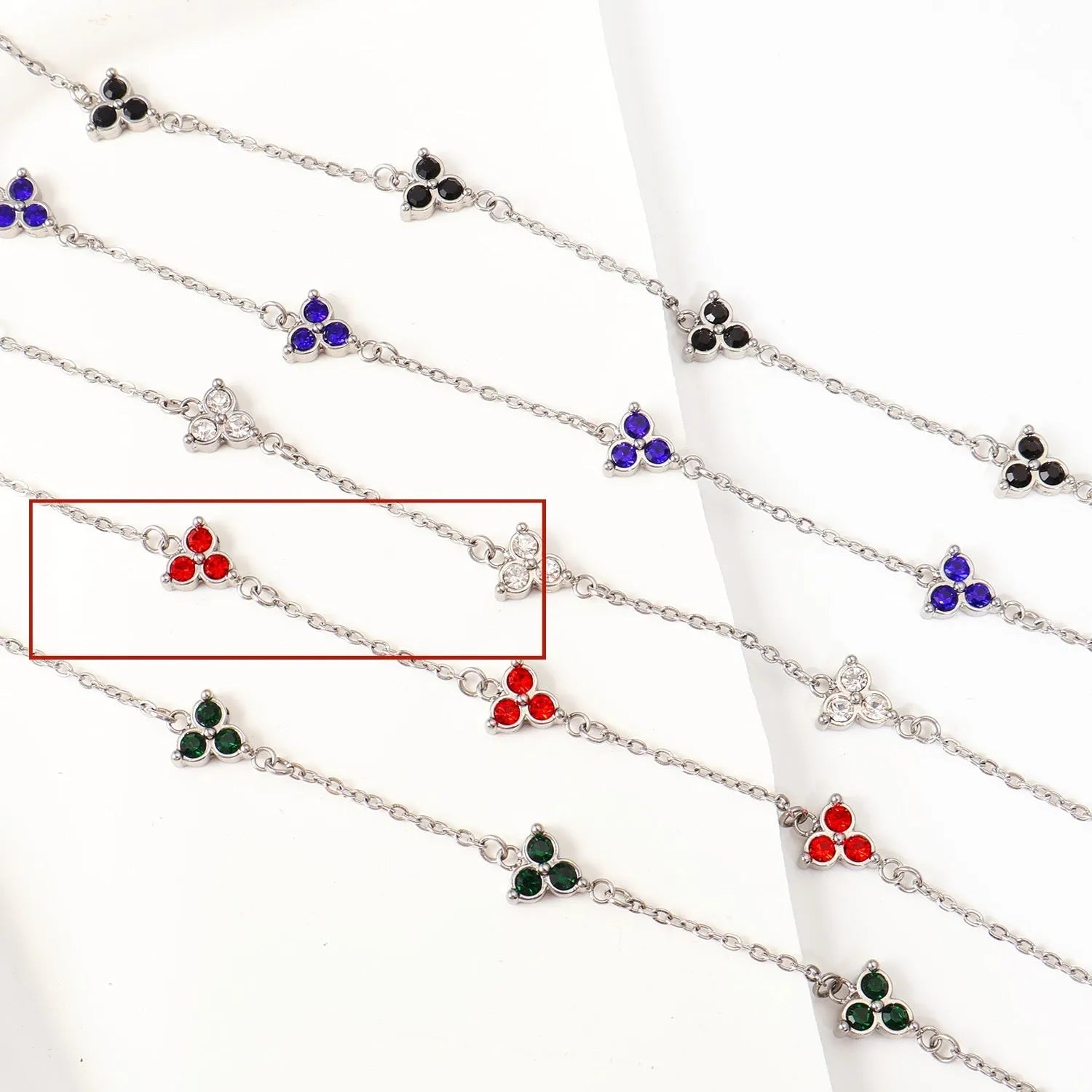 Geometric triangle women's bracelet in stainless steel with a choice of coloured centre stones on a gold or steel band.