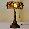 10-inch Tiffany table lamp with coloured stained glass shade and resin base on desk