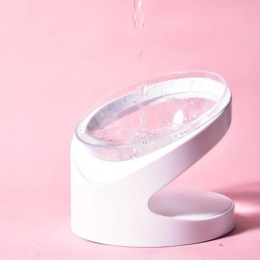 White clear plastic tilted ergonomic cat food bowl for dry and wet food.