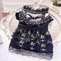 Golden Gothic princess skirt costume for a small dog on a mannequin.