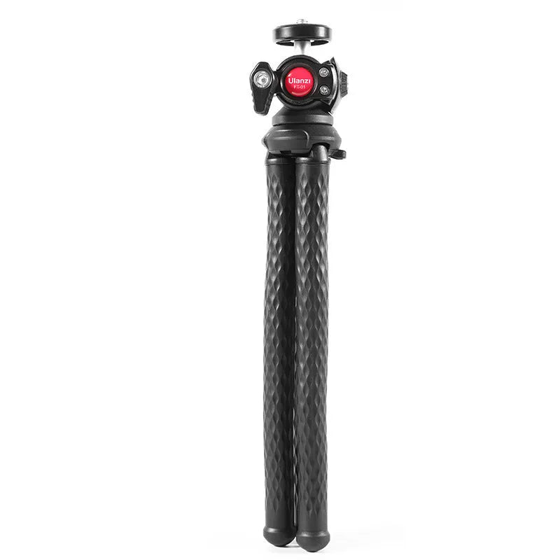 Black octopus tripod with mobile phone clip extended to 360mm length on a table