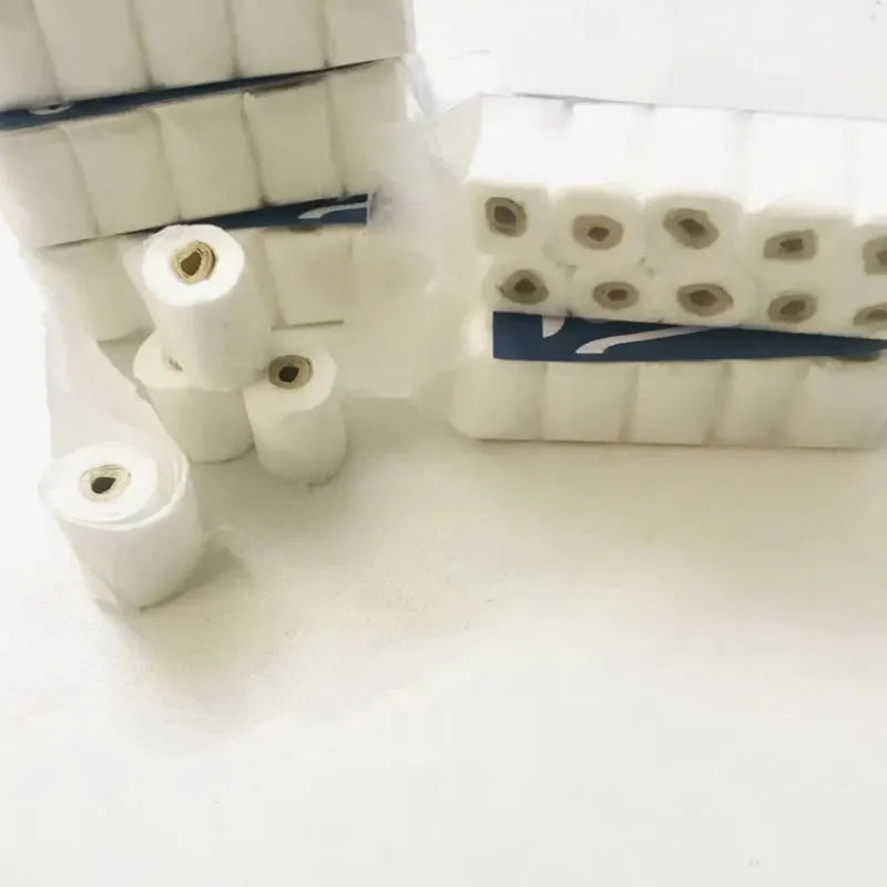 Small paper model of a tissue roll for dollhouse play, measuring 30mm by 15mm by 80mm.
