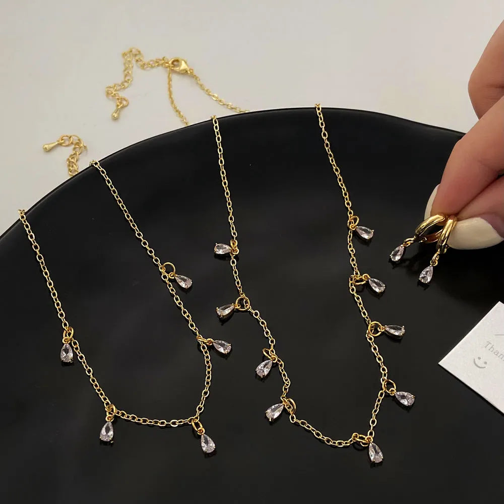 Women's zircon necklace set with matching geometric earrings and anklet featuring meteor shower pattern