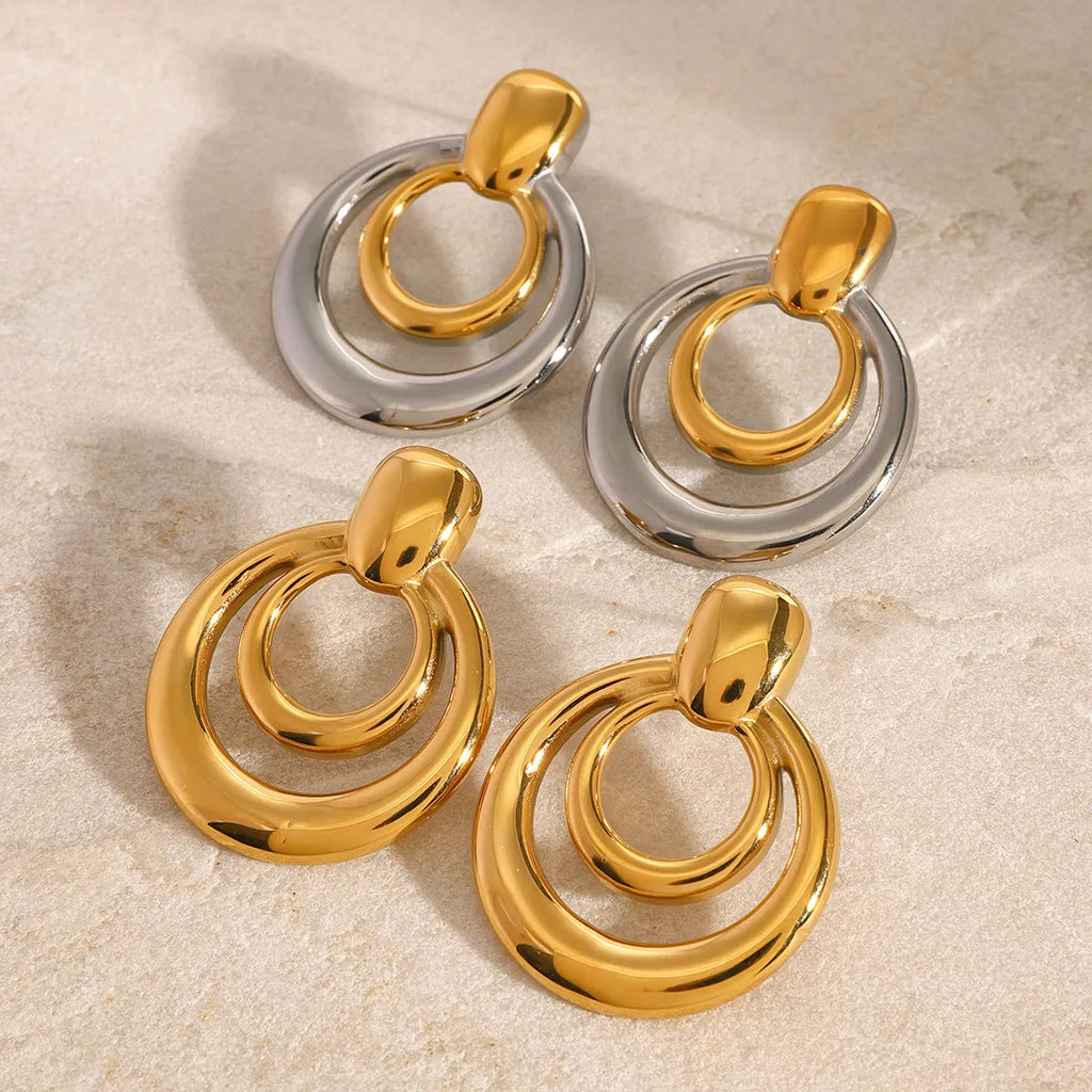 Gold geometric hollow stud earrings showing double layer round design with butterfly clutch backs