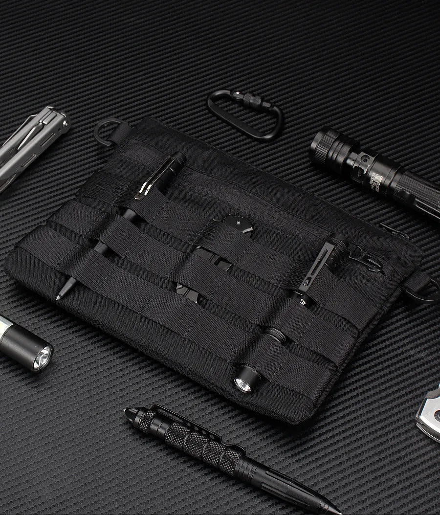 Black Oxford cloth outdoor organiser pouch with compact size for gear organisation.