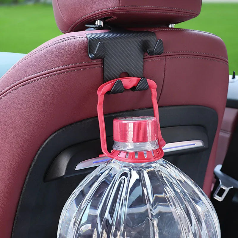 Black ABS plastic car multifunction hook bracket with integrated mobile phone holder for rear seat mounting.